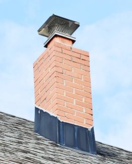 chimney with cap, flashing and red brick
