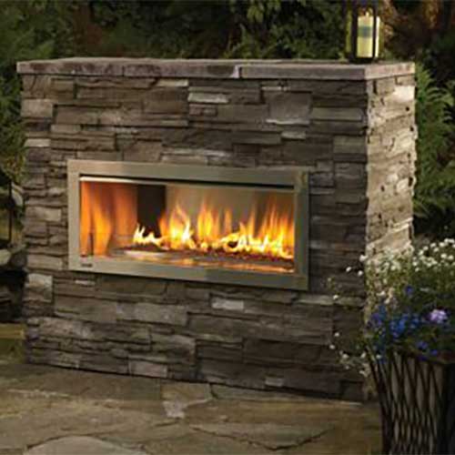 wood burning in black gas fireplace insert grey brick is framed in black wood