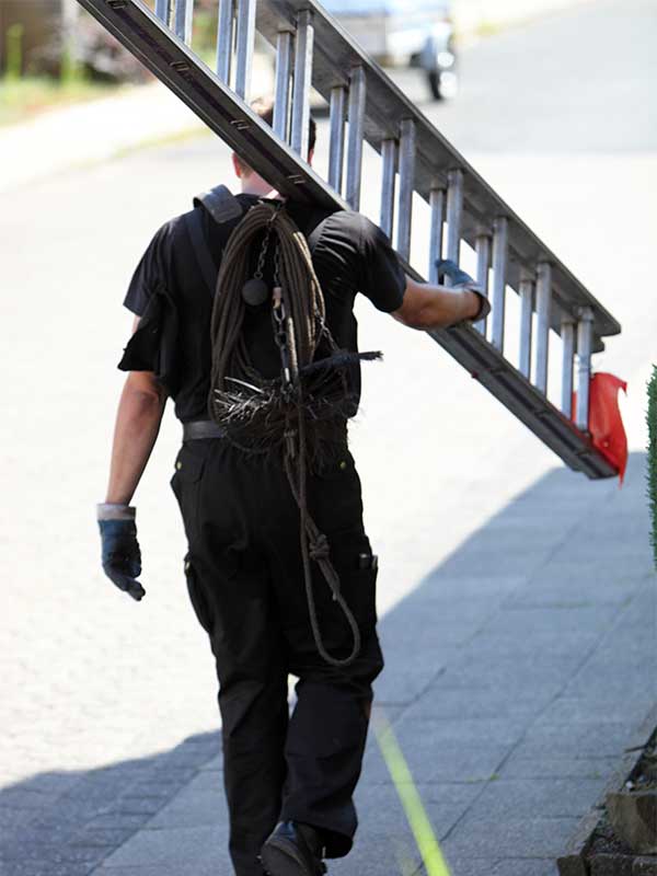Chimney sweep carrying ladder